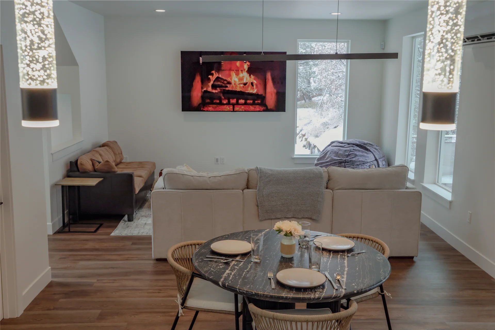 Open living room with sectional sofa and dining area
